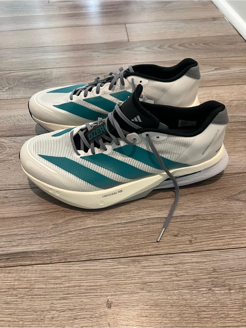 Adizero Boston 13 men’s 
Size 9.5